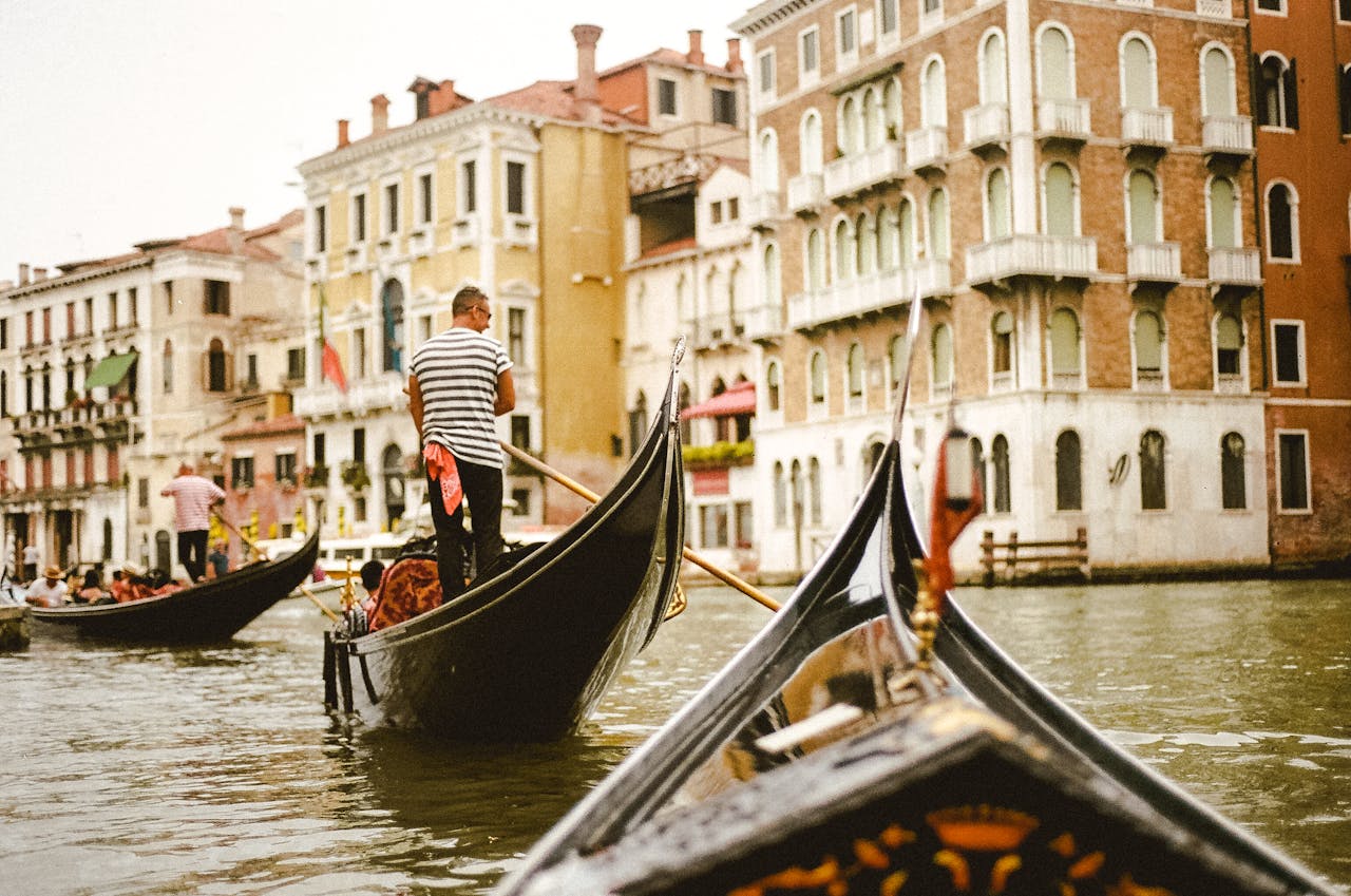 Photo Of Man Standing On Boat